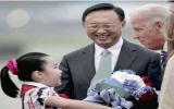 Biden arrives in China under debt cloud