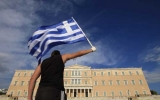 Greek PM pledges reform to counter debt crisis amid massive protests