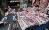 China penalizes 113 in tainted pork scandal