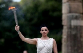 London Olympics flame lit in Olympia, torch relay begins