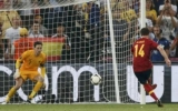 Spain ease past toothless French into semis