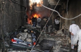 Blasts kill 54 near Syrian capital as jet downed