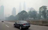 Indonesia sorry over haze, sends thousands to fight fires