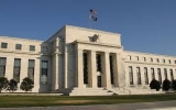 U.S. Fed announces further cut in bond purchase program