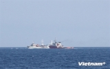 China sends big fishing vessels to protect illegal rig