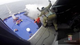 Italy says 265 rescued from ferry, more than 200 still stranded