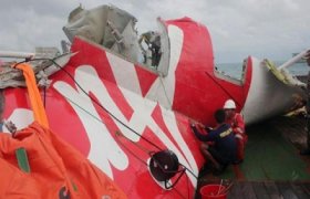 Divers find bodies belted in seats near fuselage