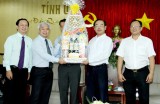 Local leaders receive leaders of HCMC National University, Vietnam Rubber Corporation