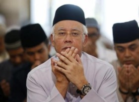 Malaysian PM says committed to search for missing plane