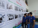 Young factory workers learning and following President Ho Chi Minh