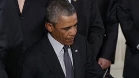 Obama signs trade bills into law
