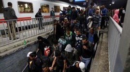Germany re-imposes border controls to slow migrant arrivals