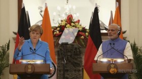 Modi and Merkel vow trade talks and 2 billion green energy euros