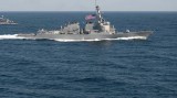 US warship sails near illegally built islands on East Sea