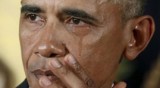 Obama, wiping tears, makes new push to tighten gun rules