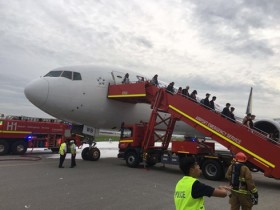 Singaporean plane makes emergency landing, catches fire