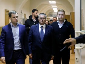 Russia's Putin fires economy minister over bribery charges