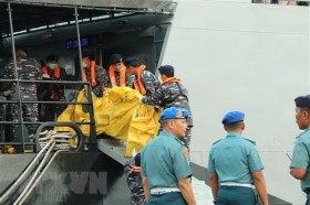 Indonesia steps up identification of plane crash victims