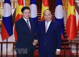 Thủ tướng Lào đến Việt Nam đồng chủ trì Kỳ họp Ủy ban Liên Chính phủ