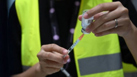 Singapore adjusts support for COVID-19 treatment cost, postpones increase of goods-services tax