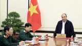 越南国家主席阮春福主持越共关于新形势下保卫祖国战略的决议实施情况总结会议