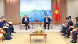 越南政府总理范明正会见希腊外长尼科斯•科齐阿斯