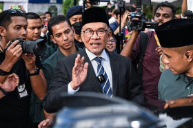 New Malaysian PM pledges to balance all interests