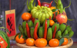 Arranging five-fruit tray during Lunar New Year celebration – a Vietnamese tradition