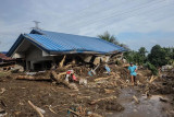 Philippines warns of new storm after deadly Trami